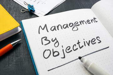 Management by objectives mark in the open notepad.