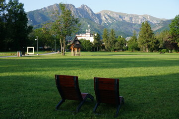 Fototapeta Two seats with mountain views in the resort town. Zakopane, Poland. obraz