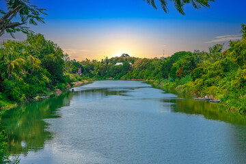 Fototapeta premium Luang Prabang Laos, beautiful river surrounded by lush green mountains and lovely historical houses