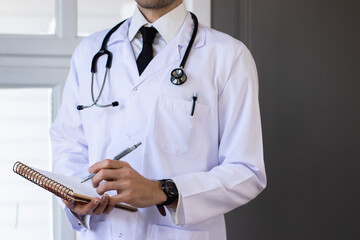 male doctor with stethoscope and white coat