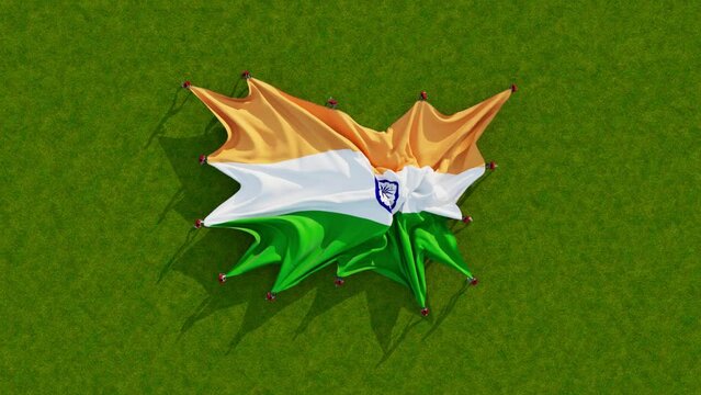 Unfurling the National flag of India on green grass