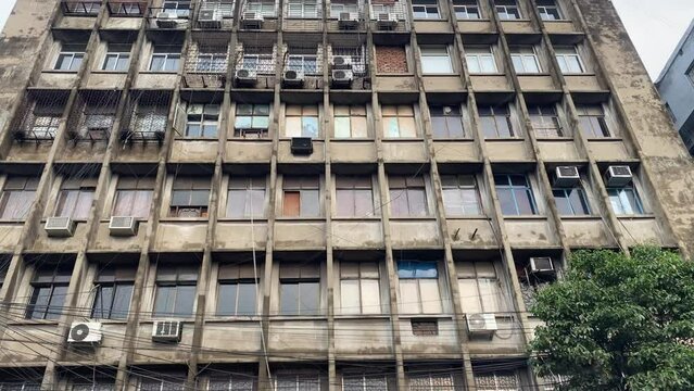 Video of old building with multiple windows and AC vents In Kolkata. India