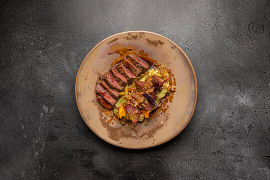 grilled steak with gourgette and varied vegetables