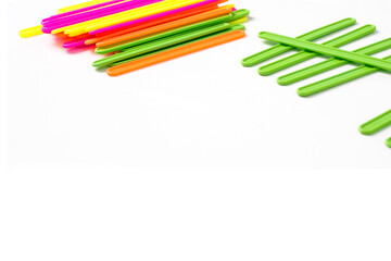 counting colorful sticks for the purposes of early education, development, learning to count and play. Banner with colored sticks on isolated white background