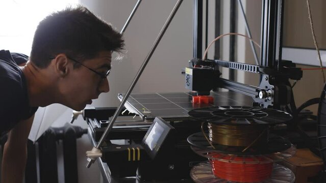 3D printer working close-up. High-tech fast printing of bulk plastic parts with heated polymer materials. Machine creates a modern prototype object.