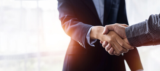 Businessman handshake for the teamwork of business merger and acquisition Successful business...