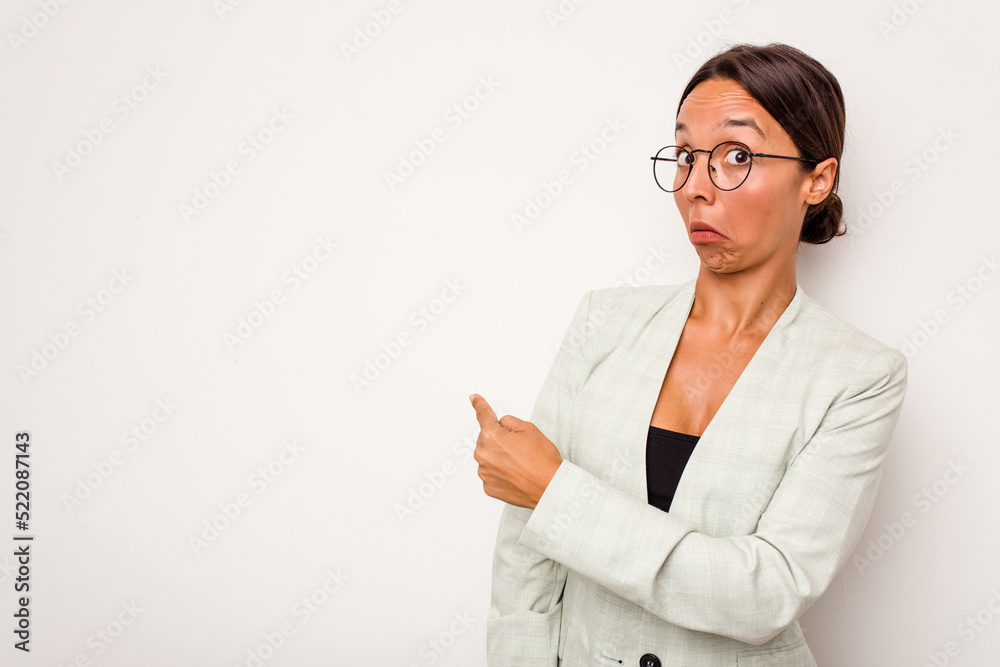 Poster Young hispanic woman isolated on white background smiling and pointing aside, showing something at blank space.