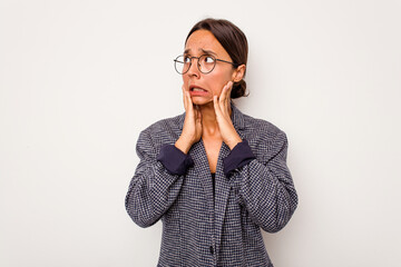 Young hispanic woman isolated on white background scared and afraid.