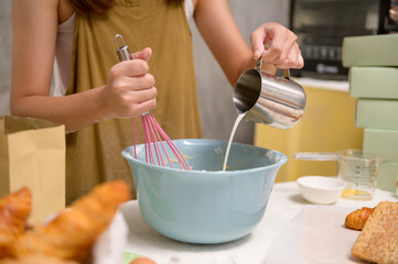 Close up of Young beautiful woman is baking in her kitchen , bakery and coffee shop business
