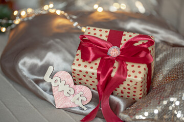 Gift box and decorative detail with the inscription Love is.