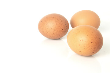 Fresh eggs are isolated on white background.