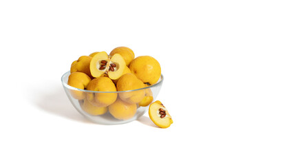 Quince in a transparent bowl isolated on a white background. Yellow ripe fruit. Copy space. Fresh organic food.