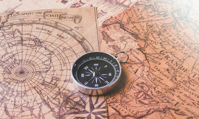 Fototapeta na wymiar Looking for adventure. Compass and maps. Treasure map and path to the treasure.
