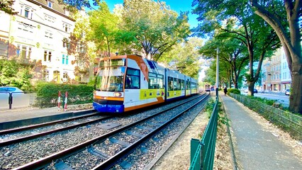 tram passing between trains in Mannheim, Germany 