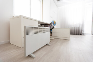 Modern electric infrared heater in living room