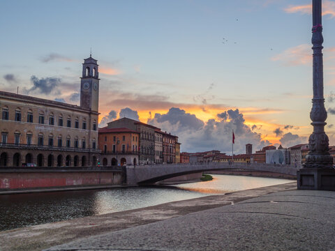 View of the Arno at sunset from the city of Pisa