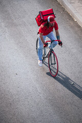 Man who works delivering food by courier at high speed through the city.