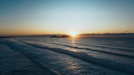 sunrise on the beach blue sky yellow sun