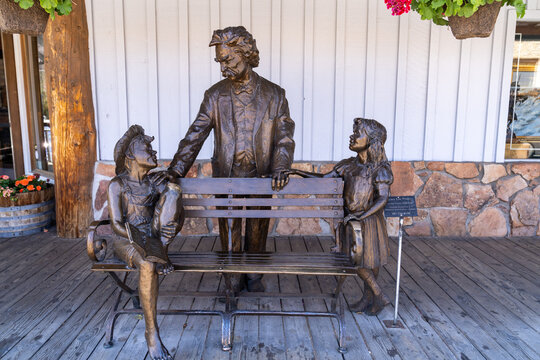 Jackson, Wyoming - July 20, 2022: Mark Twain sculpture and bench in downtown Jackson, Wyoming