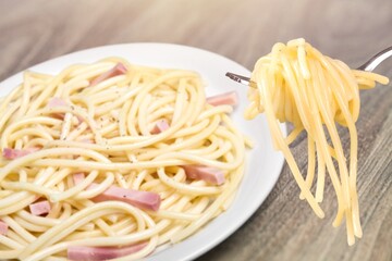 Tasty Chicken fettuccine noodles on white plate