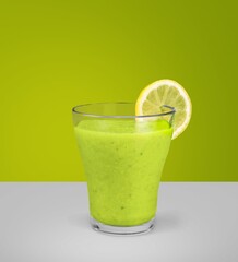 Juice on a color background, in bright light. Glass of Juice with blended fruit. Summer tropical...