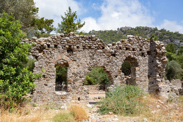 Fototapeta na wymiar Ancient Byzantine ruins in Olympos town, Cirali, Antalia, Turkey
