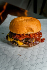 Double cheese burger with spicy bbq and bacon