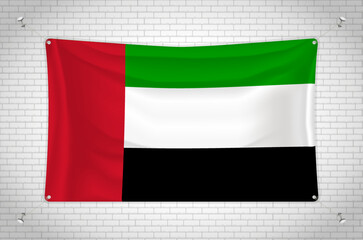 United Arab Emirates flag hanging on brick wall. 3D drawing. Flag attached to the wall. Neatly drawing in groups on separate layers for easy editing.