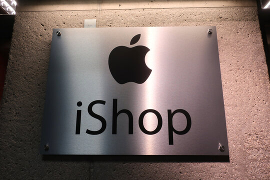 iShop signage at iShop & Mac Store Stara Papiernia. Konstancin-Jeziorna, POLAND - JULY 20, 2022