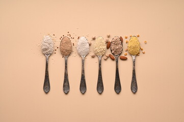 Spoons of various gluten free flour. Flat lay, top. - obrazy, fototapety, plakaty
