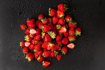 Fresh Strawberry on dark background. Close up top view. Selective focus. useful product