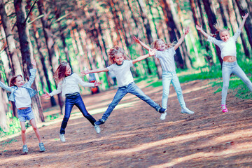 A group of girls having fun in the forest.