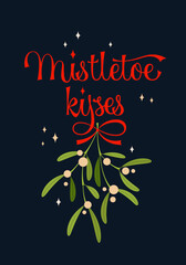 Mistletoe kisses - calligraphy lettering design with branch of mistletoe and red ribbon.
