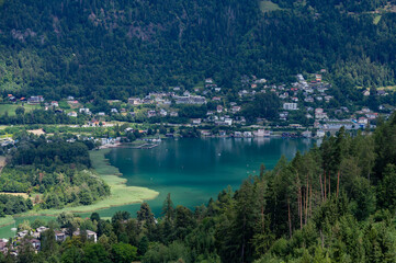 color photo of Ossiacher lake with view to the mountain Gerlitzen in the background in Austria