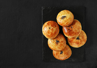 Traditional Christmas Austrian pies Mohnzelten with poppy seeds filling on dark table, top view