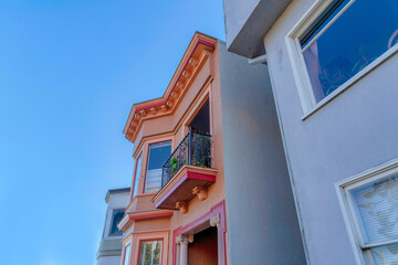 Fototapeta na wymiar Home exterior with balcony above the entrance with roman style pillars in San Francisco, California
