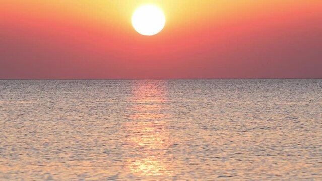 Timelapse of sunrise over the sea, view from Afandou beach on the Rhodes island, Greece, Europe.
