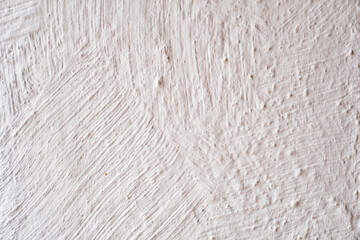 wall with white decorative plaster. background and texture of plaster.