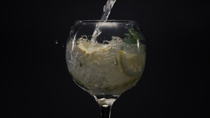 Bubbled lemon ice mint cocktail closeup. Preparing mojito cocktail concept