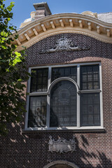 Zandvoort town hall is one of the most striking old buildings in the town. Zandvoort town hall facade using sandstone and decorations in Louis XV style. Zandvoort, The Netherlands.