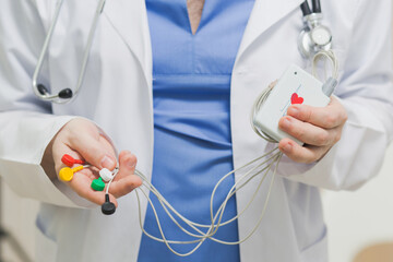Bicycle Ergometry Electrocardiography, bicycle ergometer stress test. Athlete does a cardiac stress test in a medical study, monitored by the doctor