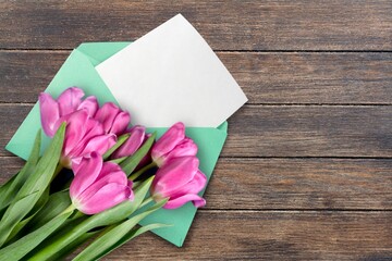 Empty 2022 Calendar with tulips. Calendar envelope on the desk