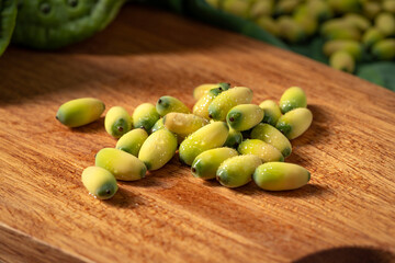 Fresh lotus seeds on a simple background
