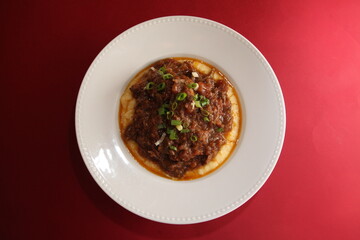 italian polenta and bolognese sauce close up top view