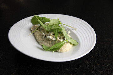 italian polenta and blue cheese dish close up top view