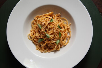 Spaghetti and wine close up table view