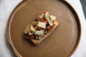 Italian bruschetta and wine glass on table top view