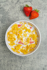 cornflakes and strawberry with milk