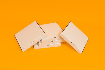 pizza boxes on yellow background