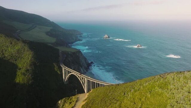 American National Scenic Byway along Big Sur coast within unique natural wilderness. Drone footage over scenic drive right up to the beach. High quality 4k footage